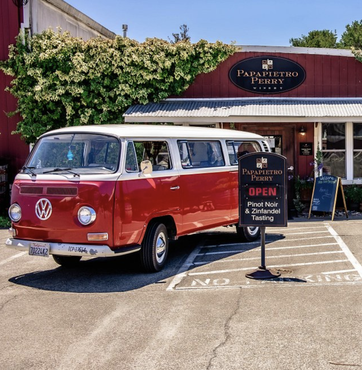 Red VW bus parked outside Papapietro Winery