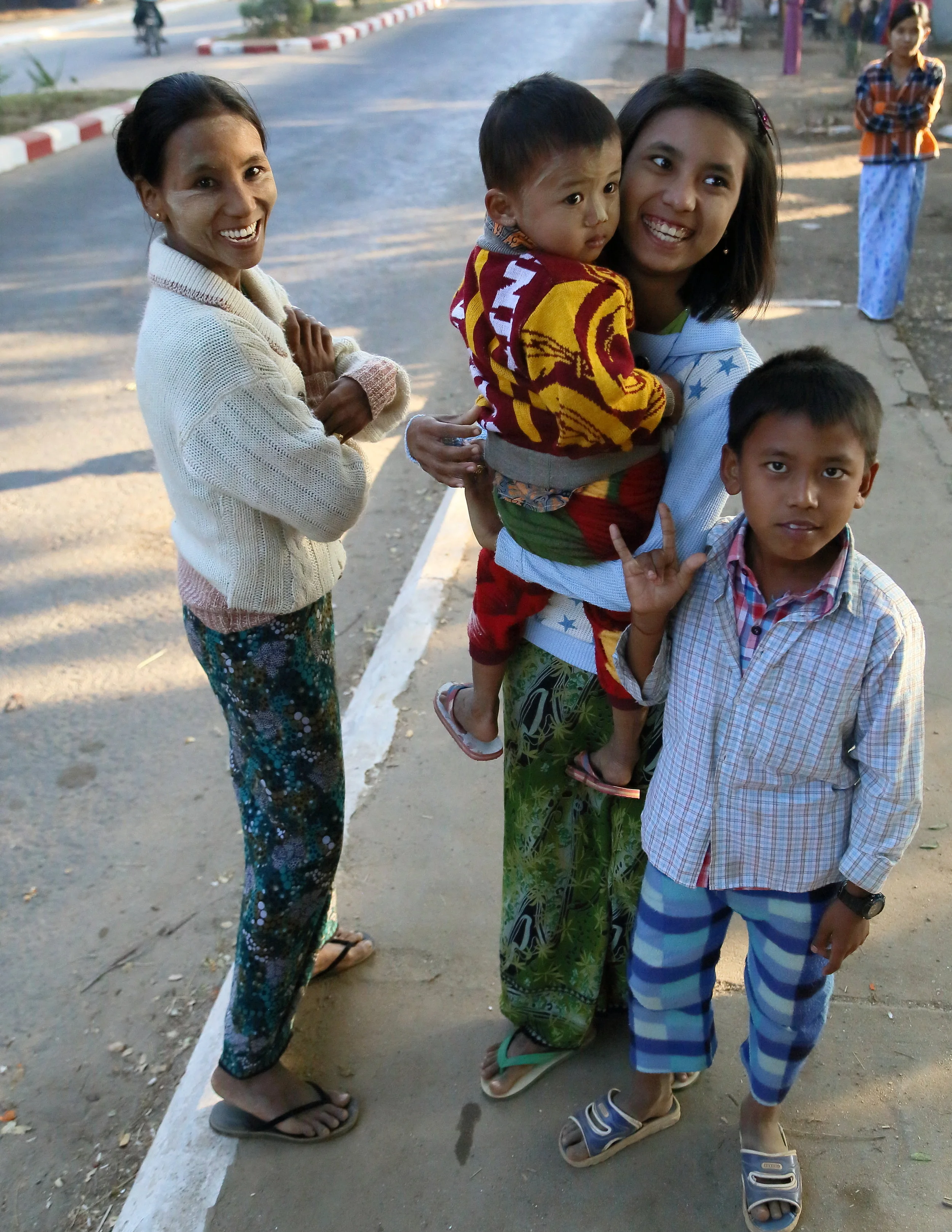  A cold morning in Old Bagan: Sisters and their children are surprised to see tourists, but are happy to pose for pictures. 