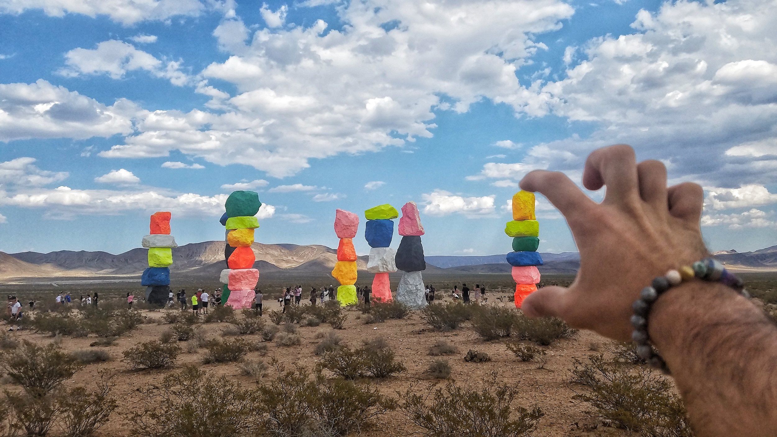 {Created on May 11, 2016, Seven Magic Mountains is the largest art installation of its kind in nearly 40 years. Renowned Swiss artist Ugo Rondinone’s colorful large-scale, public art installation can be found outside of Las Vegas, Nevada, featuring seven thirty to thirty-five-foot high dayglow totems comprised of painted, locally-sourced boulders.}