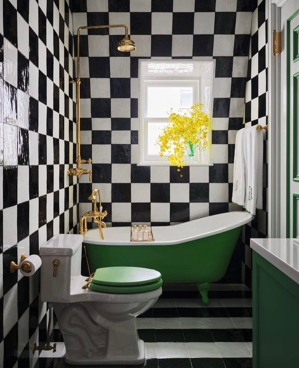 Seegerbydesign loves&hellip; the timeless nature of black and white chequerboard tiling with a strong accent of green. Repost @archdigest #seegerbydesign #bathroomdesign #blackandwhite #chequered #green #brasstaps #tiling #greenvanity #bathroomgoals 