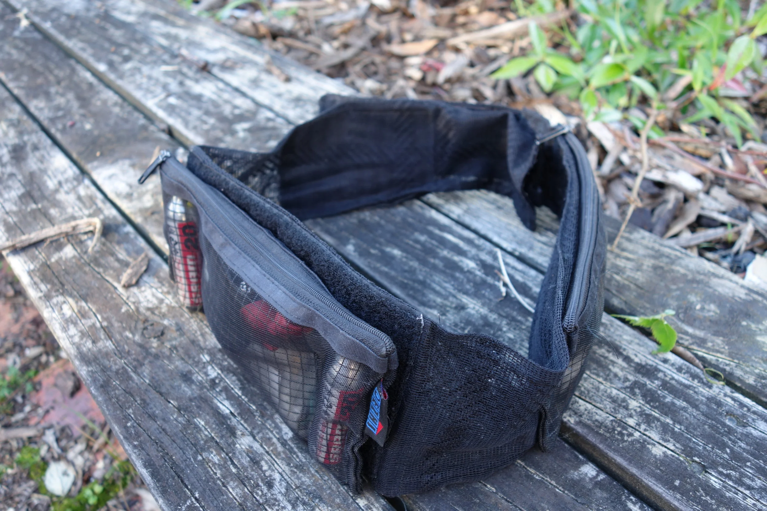 The Batman and I collaborated on this under-jersey waist belt. I wasn't always a media guru. In the 70's while still at school I formed a marble bag sewing empire, so It was pretty natural for me to move into high-end mountainbike wear manufacturing. This prototype I made from curtain mesh and a couple of pencil cases from the $2 shop. It doubles as a corset to make me look more like The Batman.