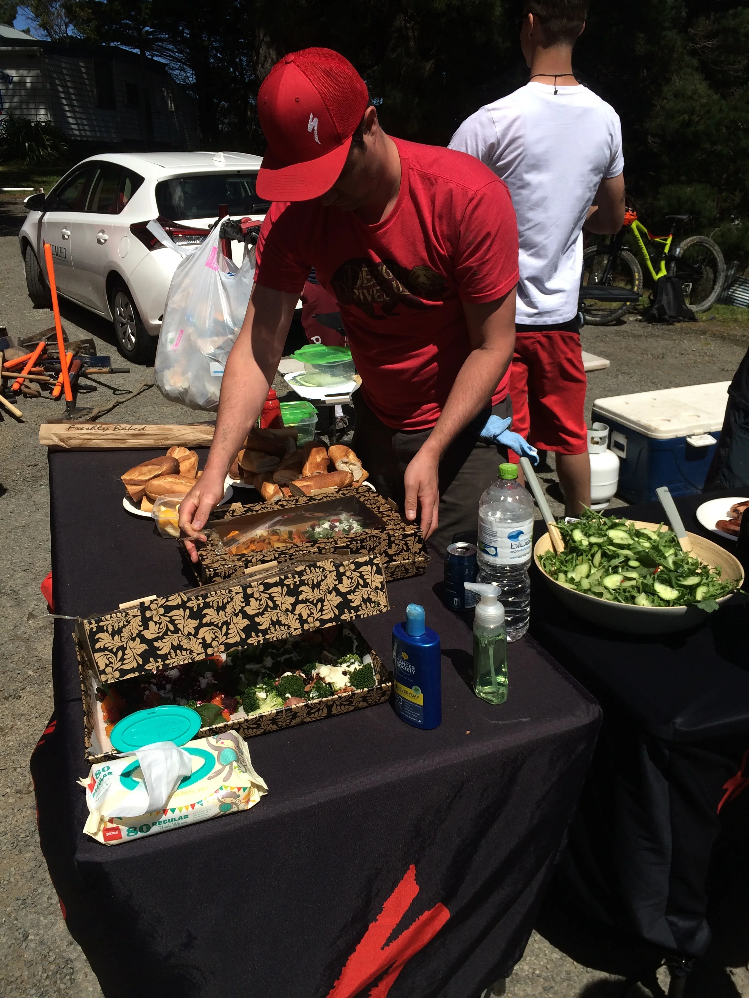 James whips up a couple of salads before the crews return.