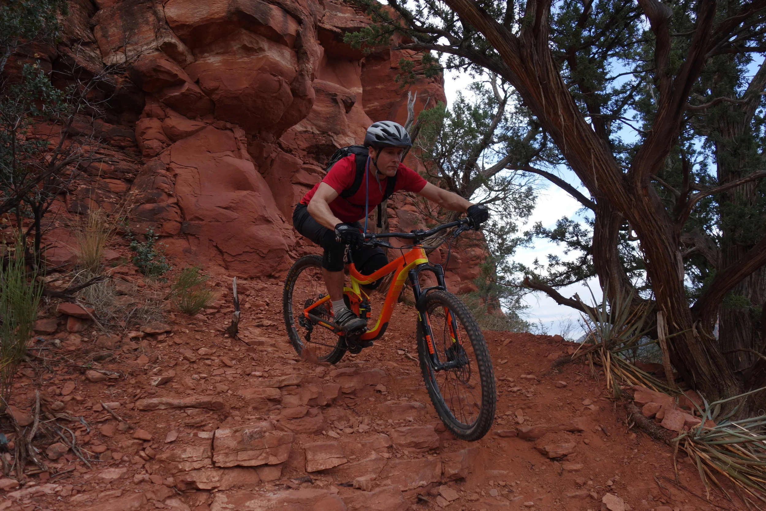James rode stuff way harder than he's used to and he just ate it up. It looks easy here but he has just exited a steep stepped ravine through that rock face.