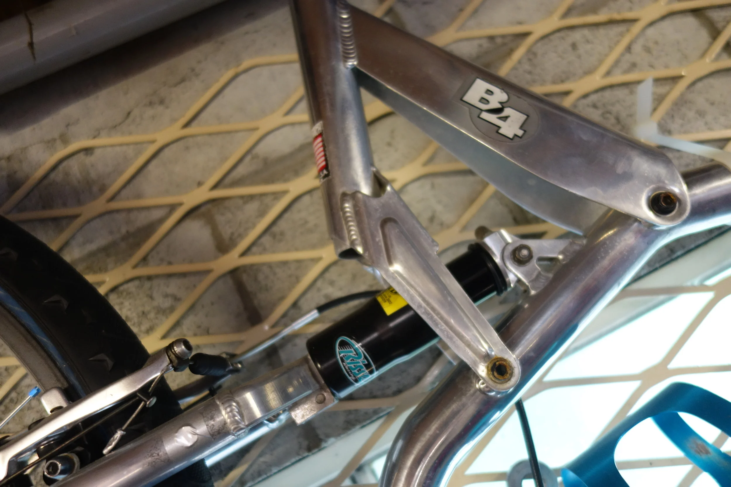 It was a thing of CNC machining and gussetting beauty . Risse rear shock. About 60mm of travel front and rear from my demented memory.
