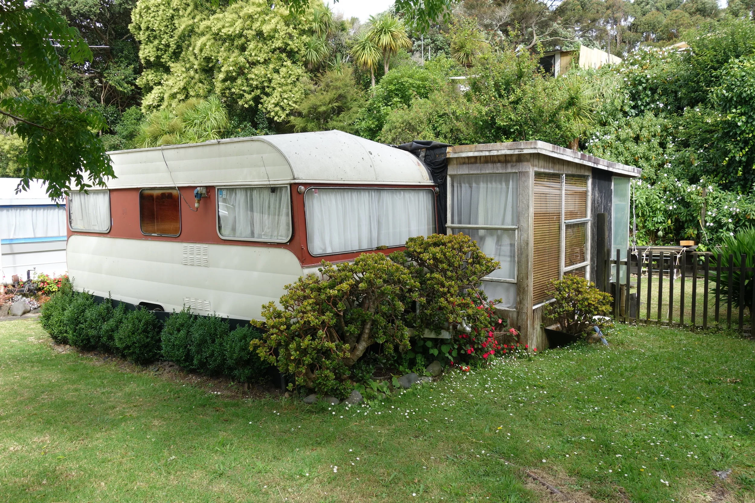 The Orere Point Holiday Camp is full of privately owned caravans with attached kitchen/lounge units and fenced off yards. so cute.