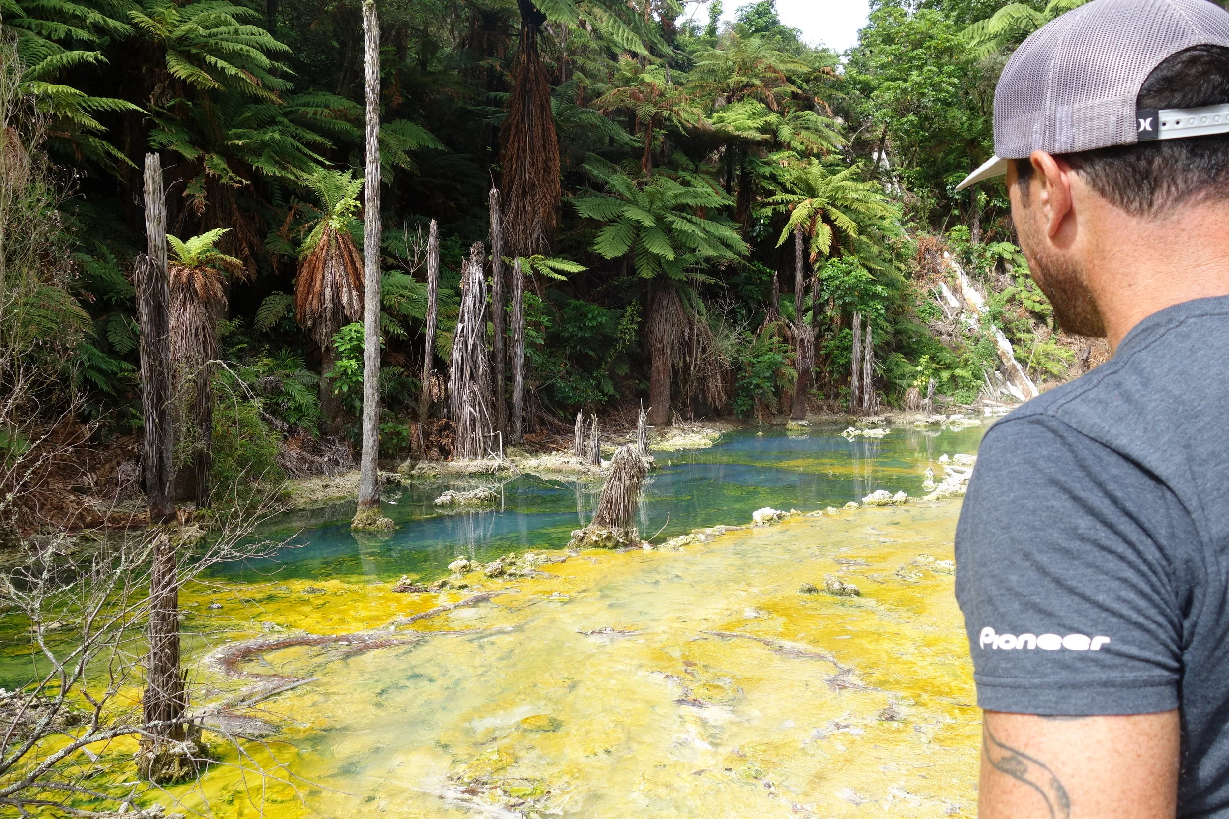 Richard in awe of the boiling hot water stream behind Wairakei Hotel. 