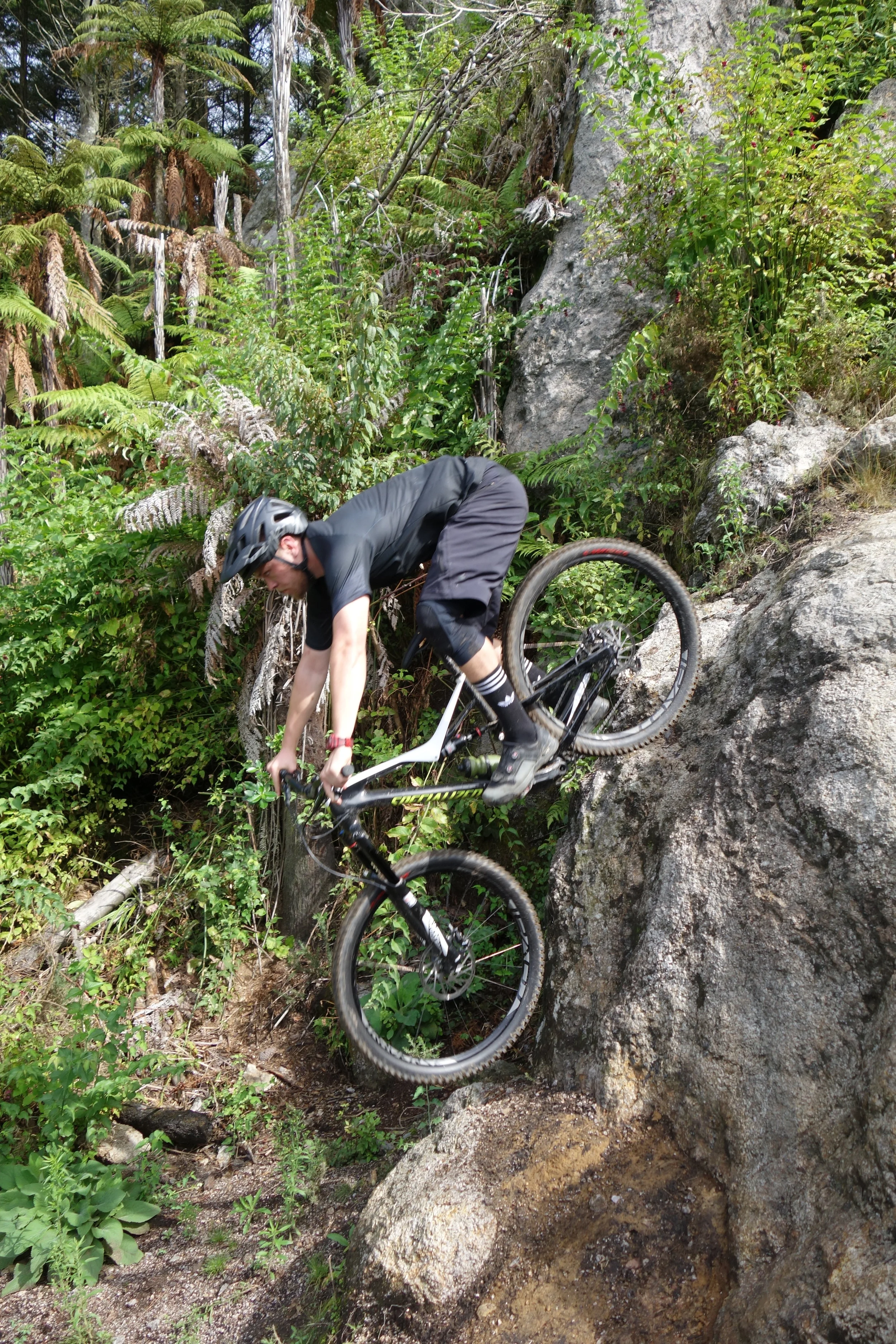 The rock drop on Boulder Dash is pretty damn steep when viewed from the side (and above). It's borderline over the bars if you try and roll it. Caleb again...RAD!
