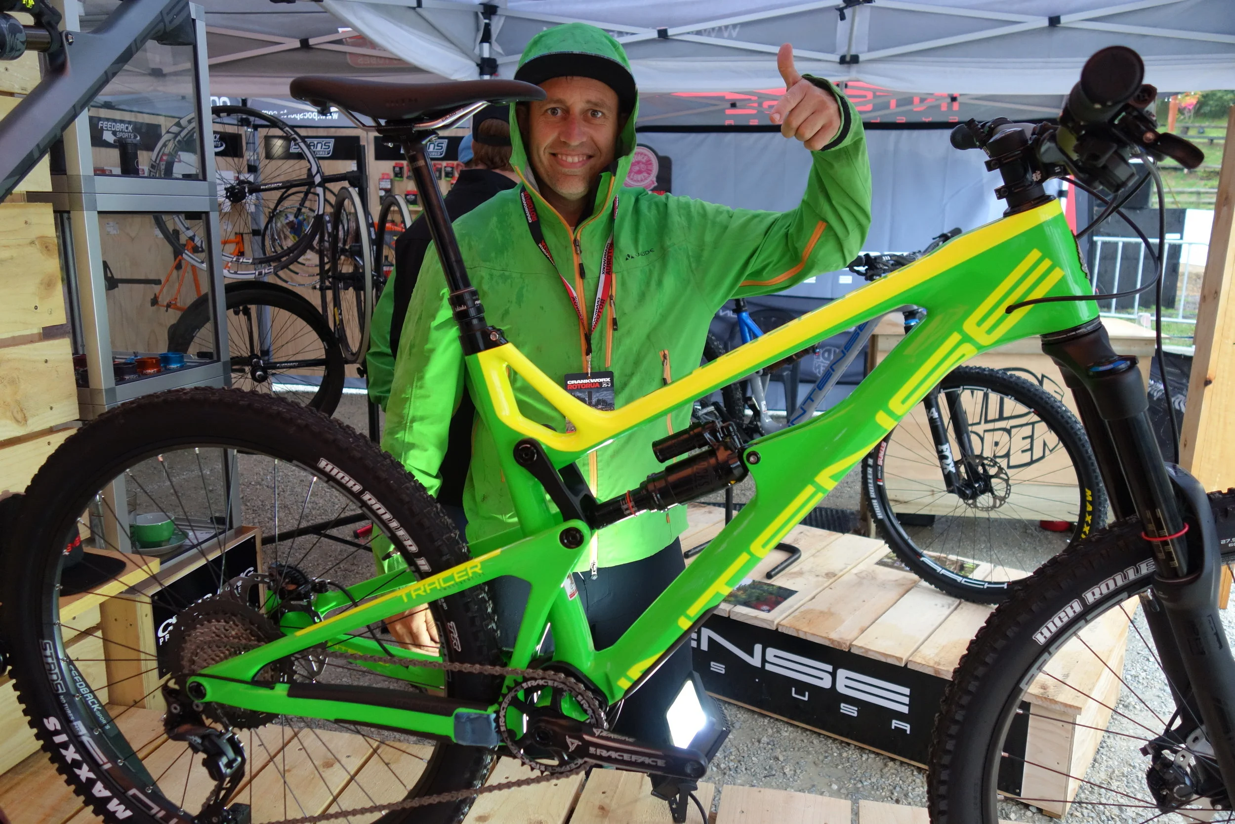 Jeff finally finds a bike to match his jacket. Intense Tracer have this cheaper frame option with a slightly heavier carbon and an alloy top link. The more expensive version has titanium hardware and a carbon link in a lighter frame