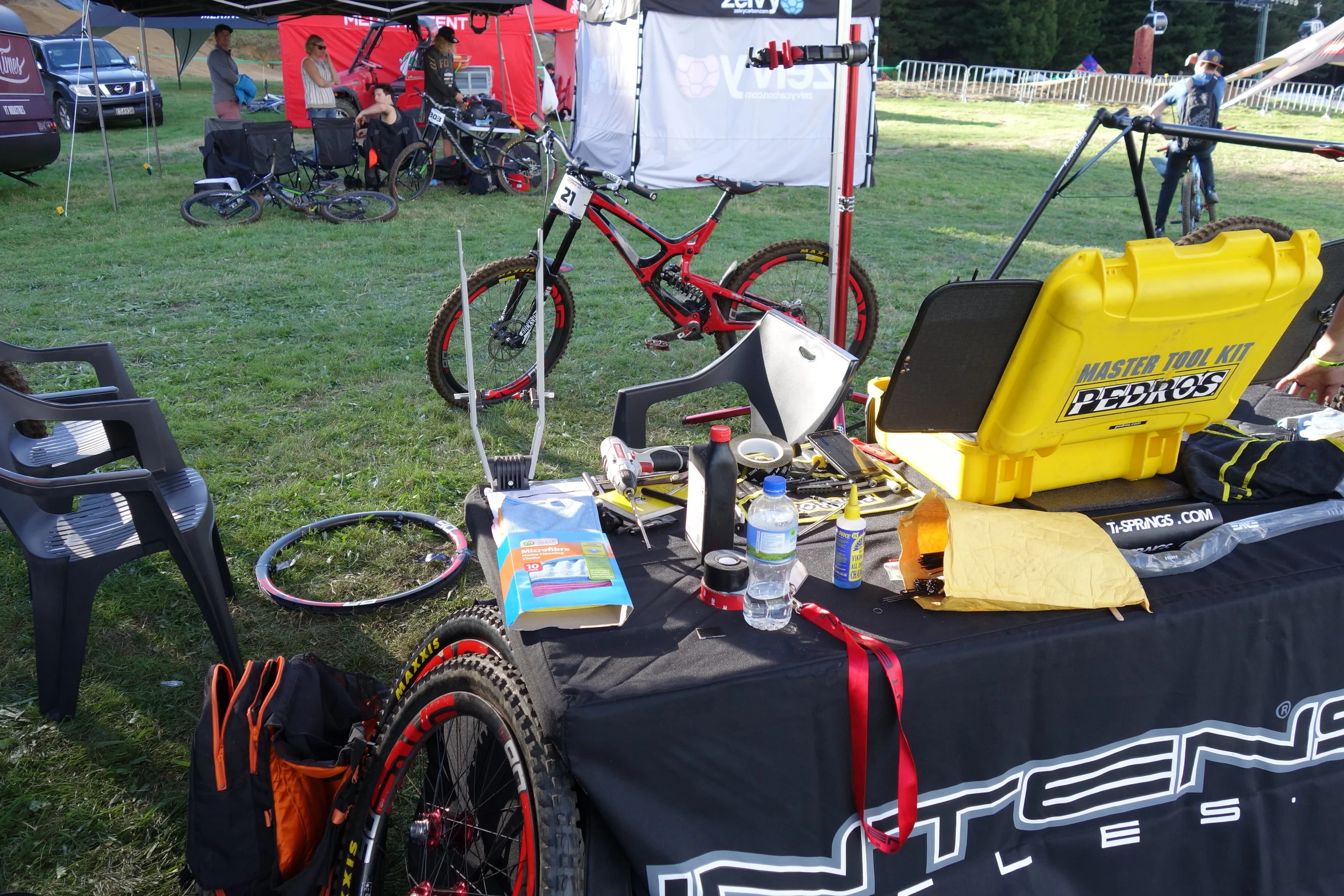 Intense Factory Racing. It can't be easy servicing bikes in a paddock "Crap where'd that washer go?"