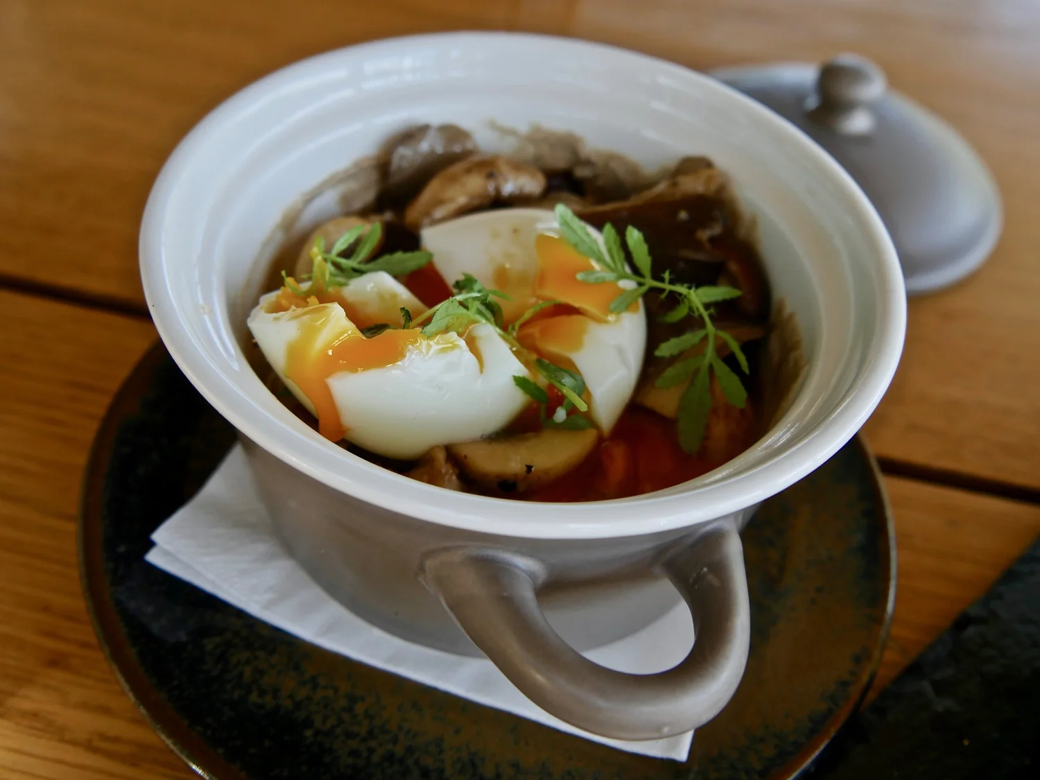  3 textures of mushrooms with a poached egg and fresh local herbs. 