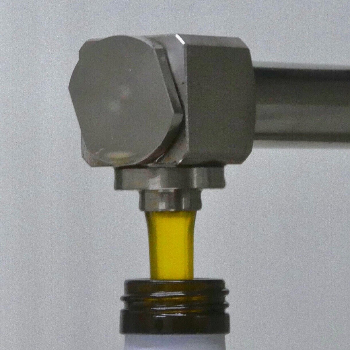  Post-decantation, the “liquid gold” flows  into bottle…   