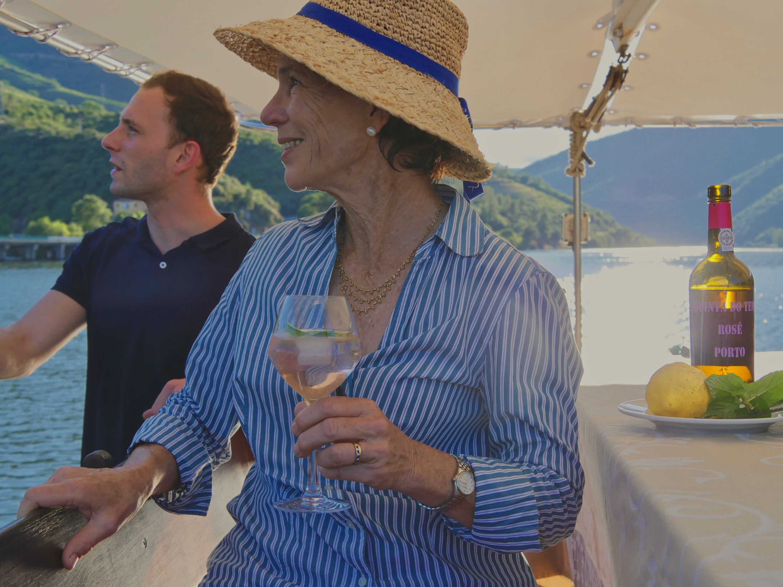 Kay (owner) and António Jr (RIVUS boat sommelier) admiring Quinta do Tedo's from Douro River, Port Tonic in hand.  (Copy)