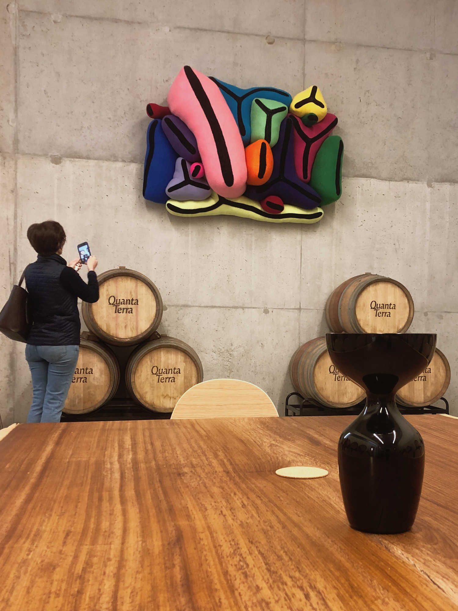 Joana's art adds shape and color to the barrel room.