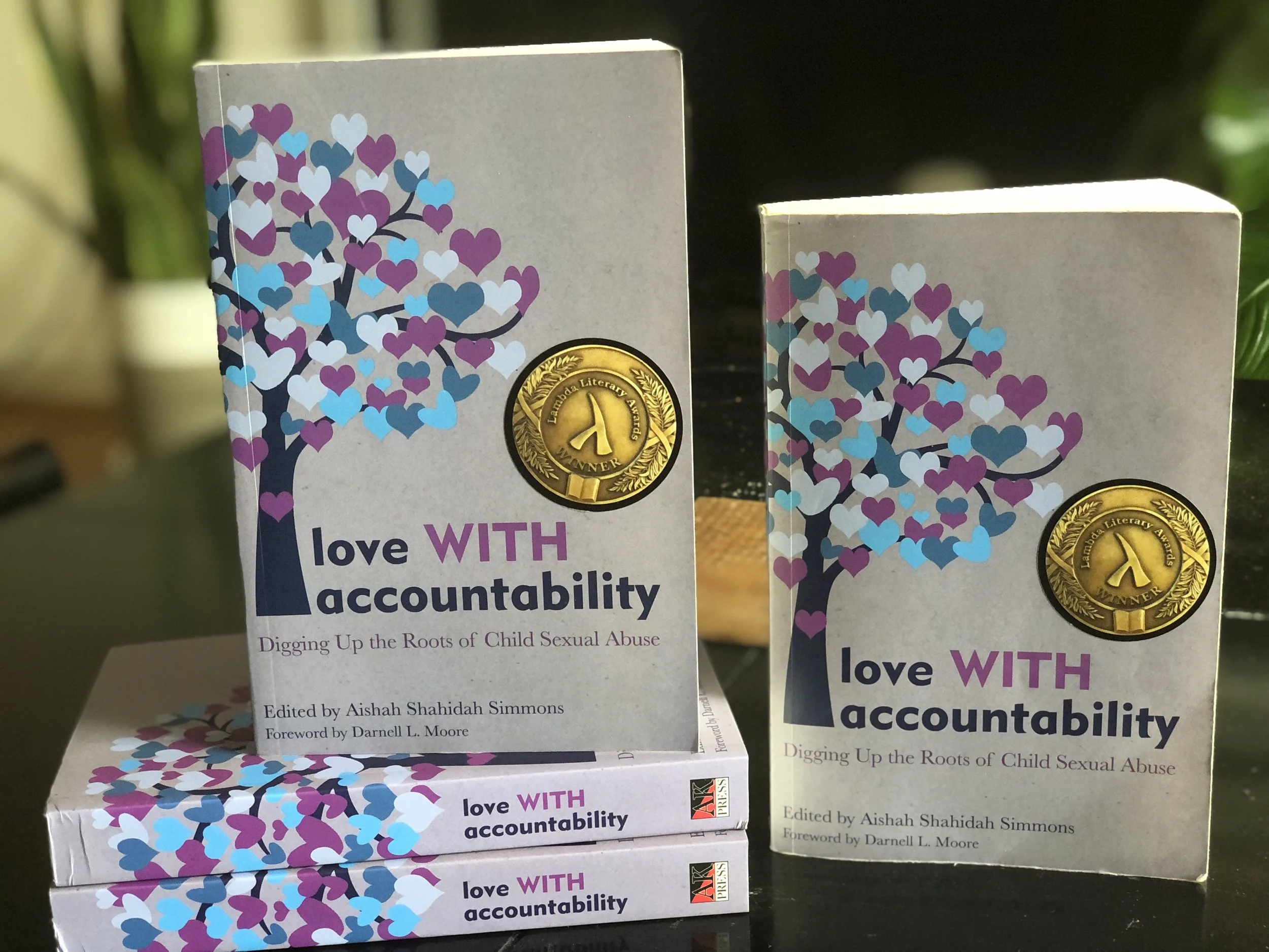 copies of the anthology, love WITH accountability with lambda literary award the cover.
