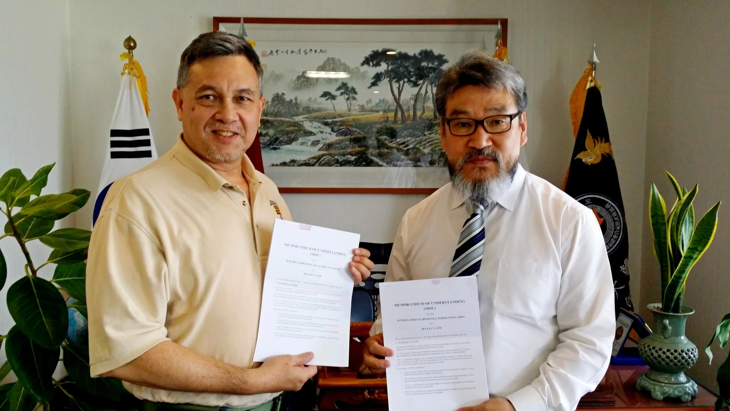 GM J. S. LIM is pictured with GM HWANG, (in tie) the Secretary General, KiDo, and President, IHF at the signing ceremony, Daehan Kido Hwe HQ.
