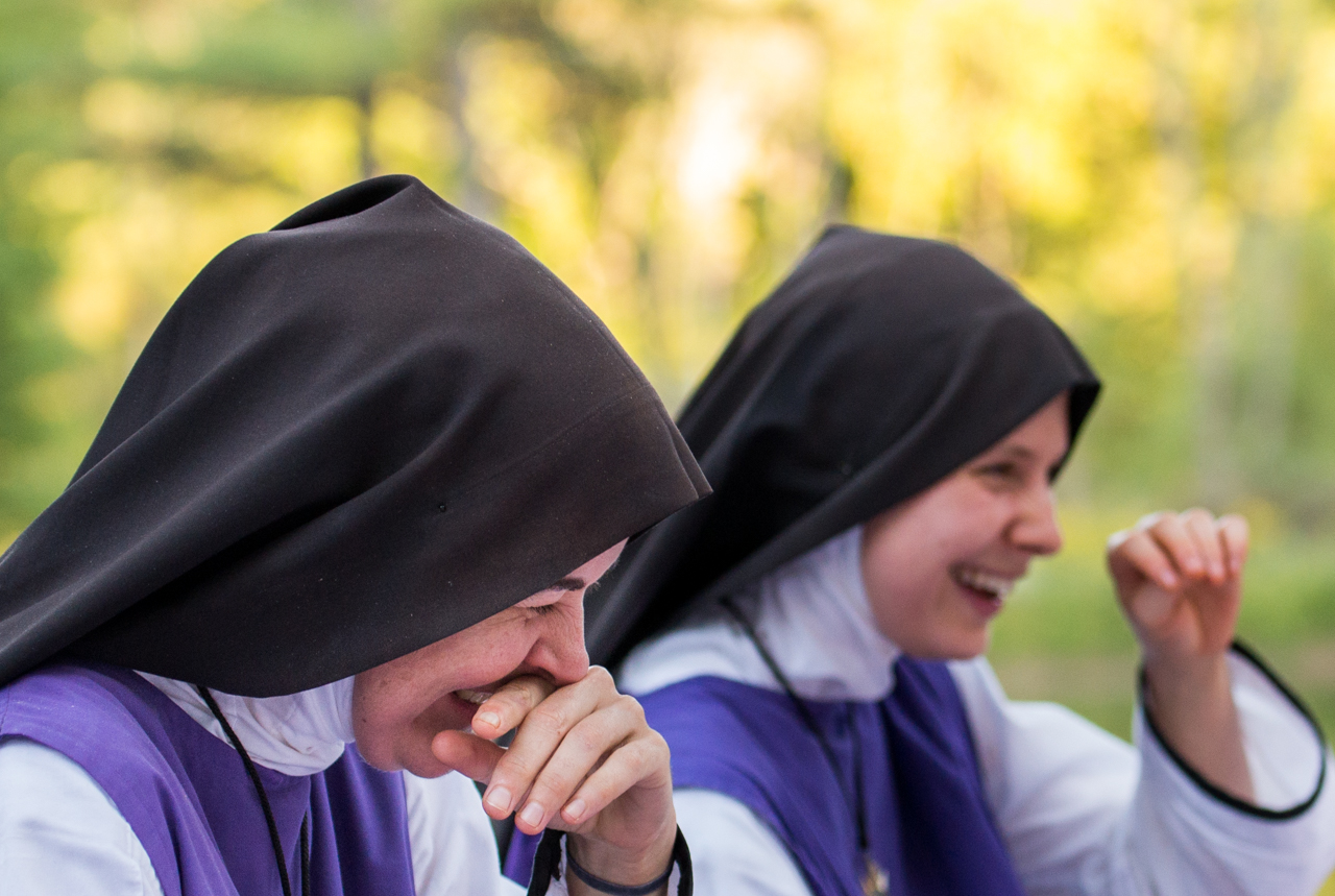 Sister Joseph Marie (left), of Bethesda, Maryland, laughing at a joke told by Sister Faustian Maria during community dinner at Children of Mary in Newark, Ohio, on September 24, 2016. Each Saturday the local family who lives up the road, on the same