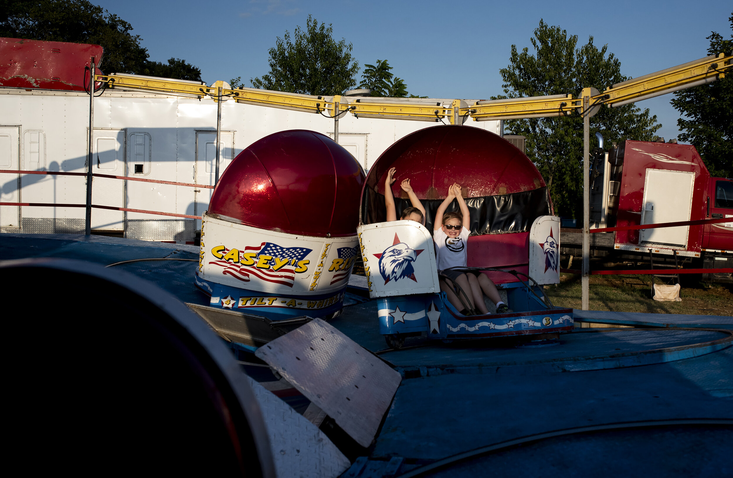  Children ride “Casey’s tilt-a-whirl” ride at the Harrison County Fair on July 23, 2019. 