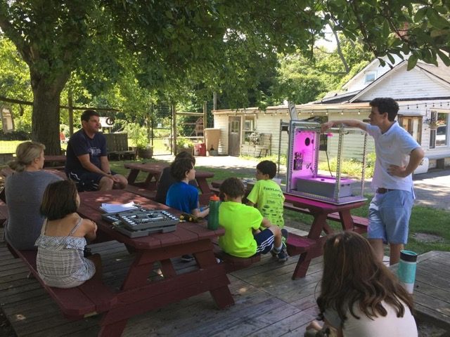 James O’Brien, a Connecticut high school senior, built and programmed his own “food computer” after watching a TED talk on YouTube; then he demonstrated the computer and the lettuce he grew with it to middle schoolers at a local summer camp. Photo: Eileen O’Brien