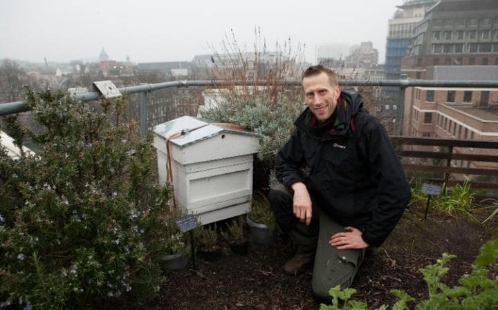 Head Gardener for Bee London Sean Gifford at the beehive at Le Cordon Bleu” CREDIT: RII SCHROER