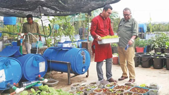 Shykh Seraj with Sheikh Al Ahmad Nahid at the latter's rooftop garden in Chittagong. PHOTO: Hridoye Mati O Manush