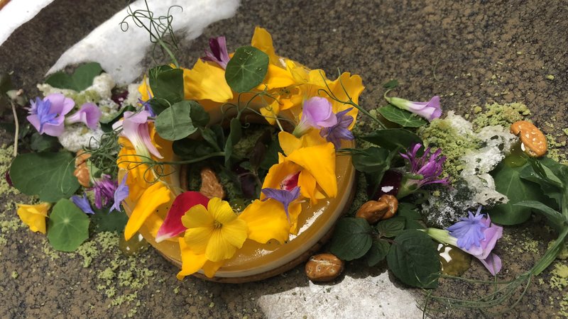At the restaurant Siren by Robert Wiedmaier, pastry chef Maddy Morrissey uses marigold as the base for a Japanese dessert served with nasturtium leaves, flower petals and pineapple sage shortbread. | Brian McBride/RWRestaurant Group