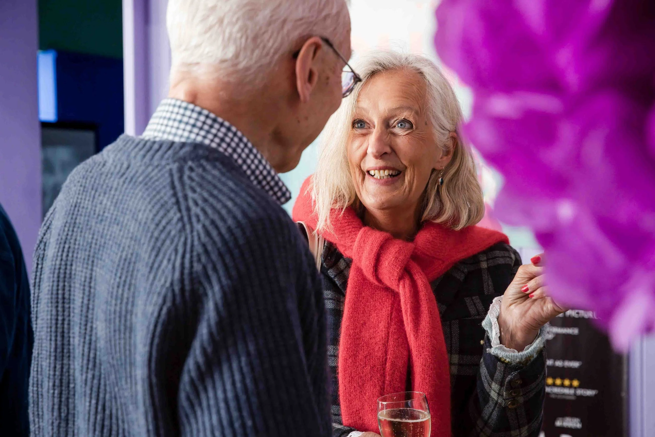 Guest smiling during Berwick Film Society’s 21st birthday celebration at Jackal in Berwick-upon-Tweed.