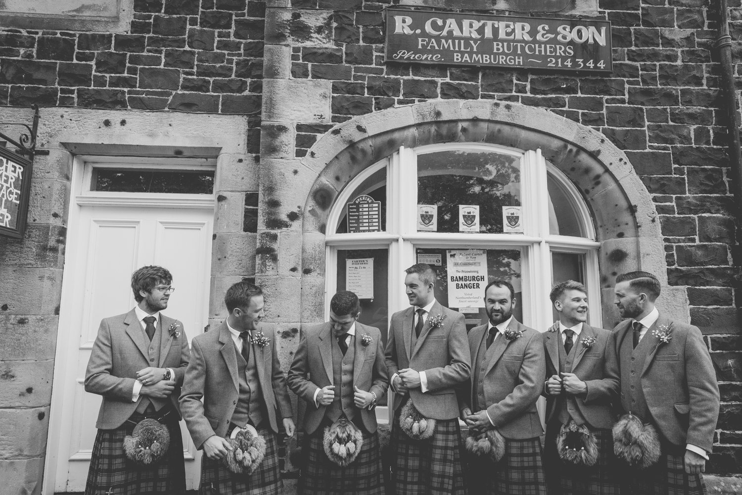 Groomsmen outside R. Carter and Son Butchers, Bamburgh (Copy)