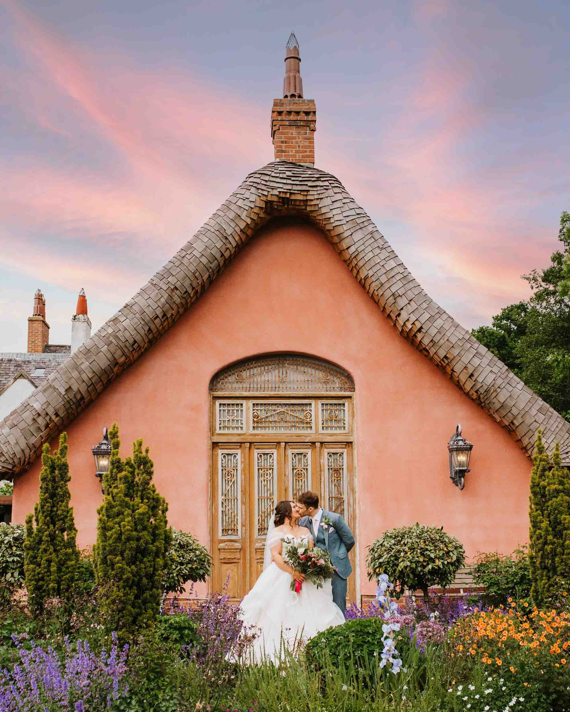 Le Petit Chateau at night, pink and purple sky with bride and groom (Copy)