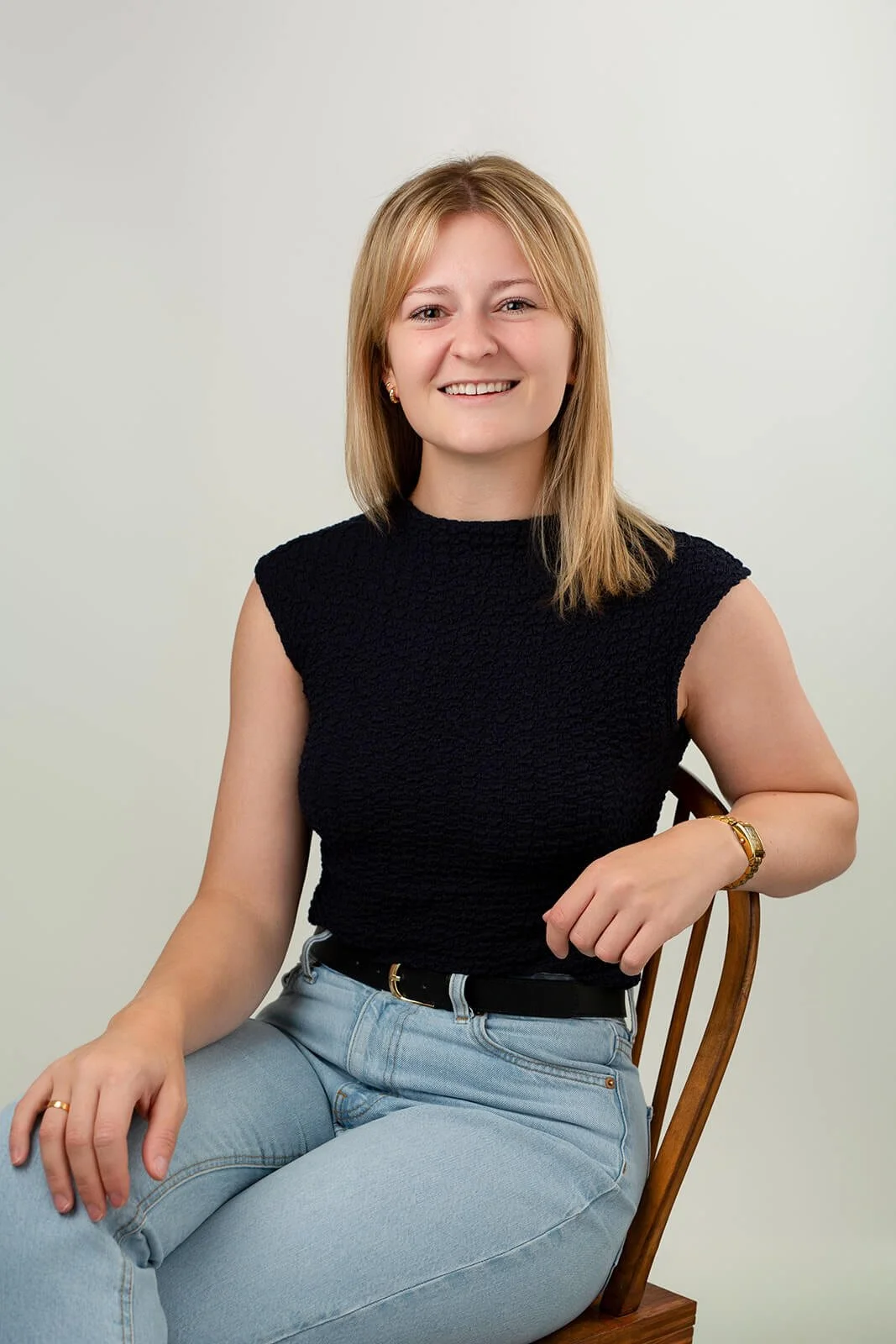 Rebecca from Socially Organised smiling naturally during her professional headshot session, photographed in soft natural light.
