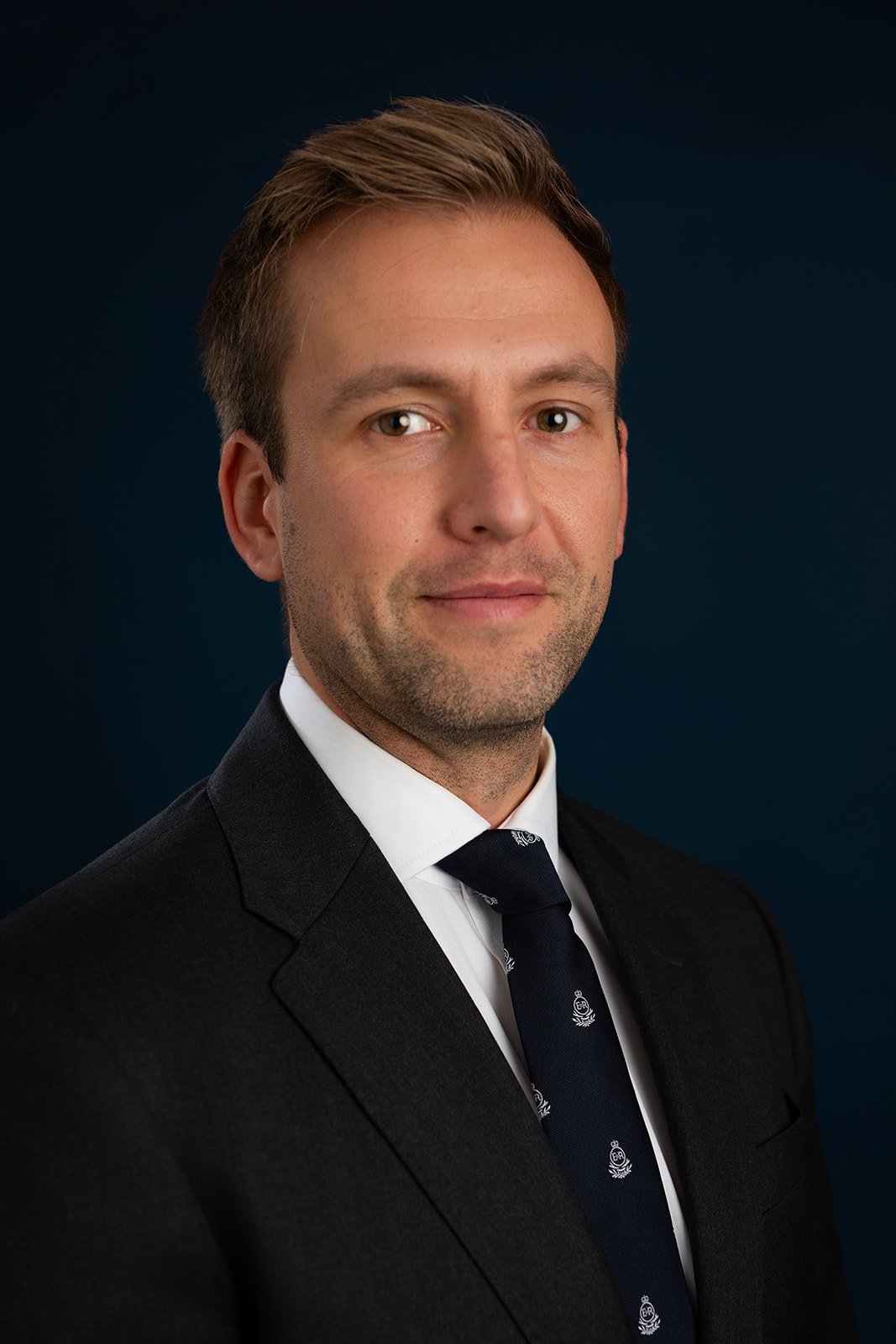 jack wearing a suit and smiling for his linked in profile picture