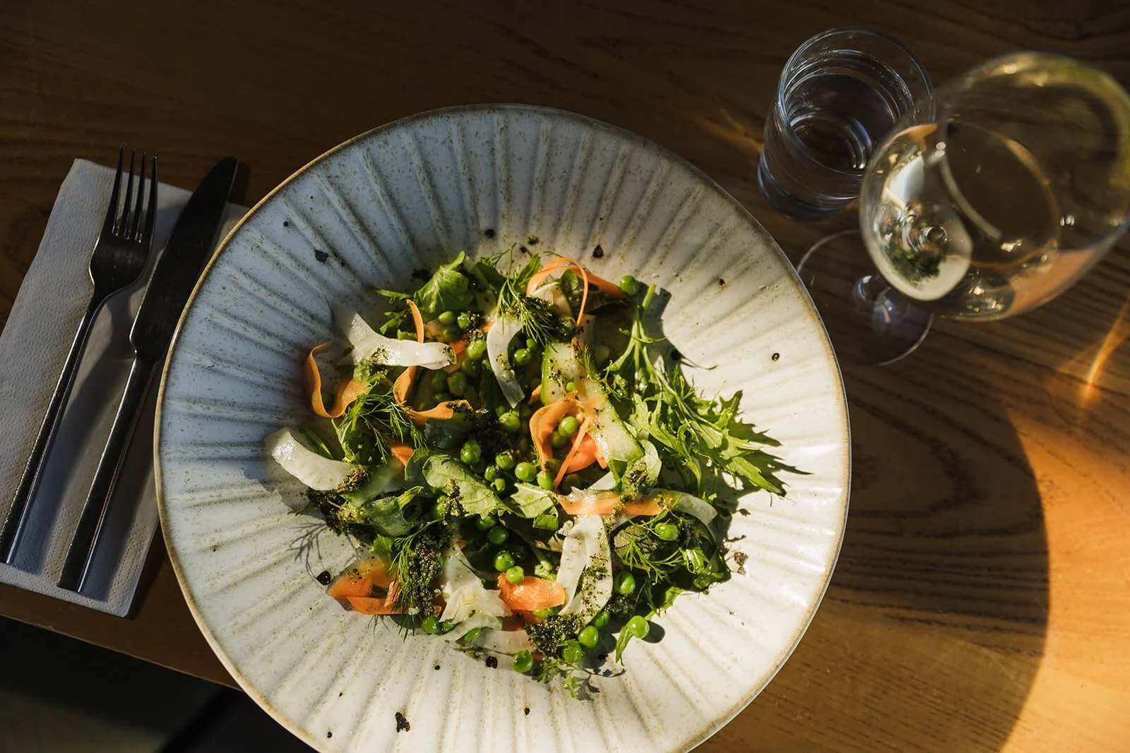 Brand photography of a fresh seasonal salad dish with greens and vegetables at Barn at Beal