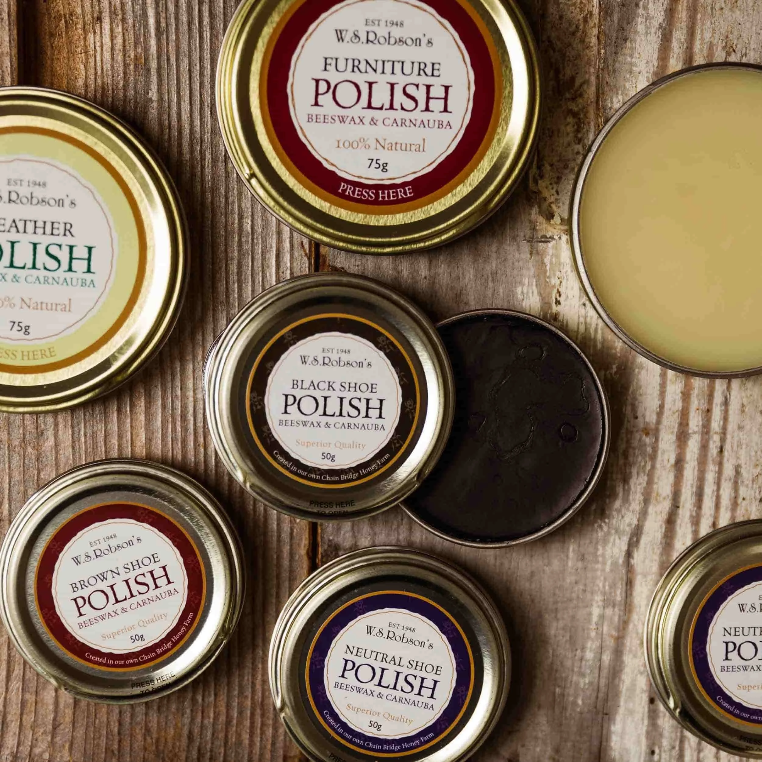 Polishes from honey farm chain bridge on a wooden background