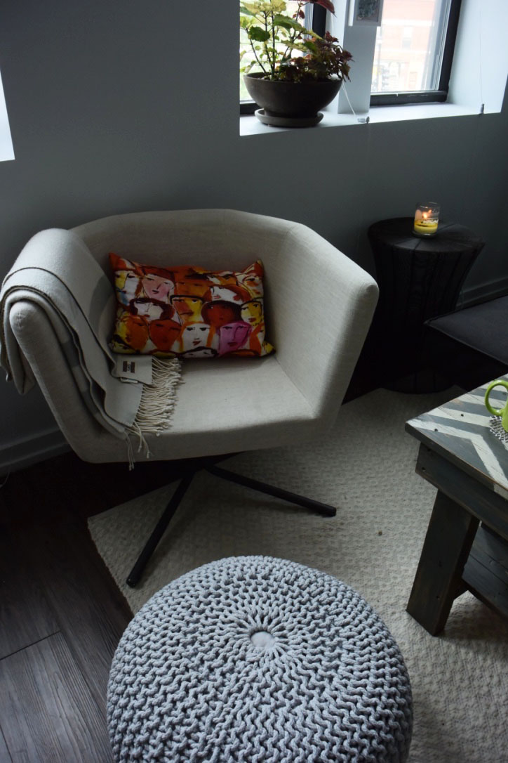 I've always wanted to own one of these knit poufs from CB2 - & now I finally do! We went with the light grey so that it doesn't distract from statement pillows like this awesome face one (unfortunately I have no idea where that pillow is from - it's several years old!).