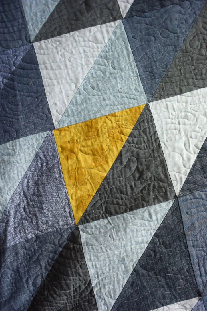 My mom made Grayson & I THE BEST quilt - it's mainly blue/gray denim & chambray triangle/squares but the back is the most awesome mustard yellow cat fabric & she threw it on one of the front triangles as well. Once I finally complete all the pillows that will go on our bed, this baby will get its own Color Inspiration post!