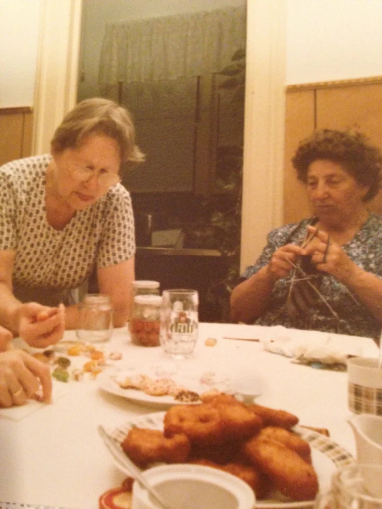 Grossma (left) & Hermine (right) surrounded by food & knitting. Definitely my family.