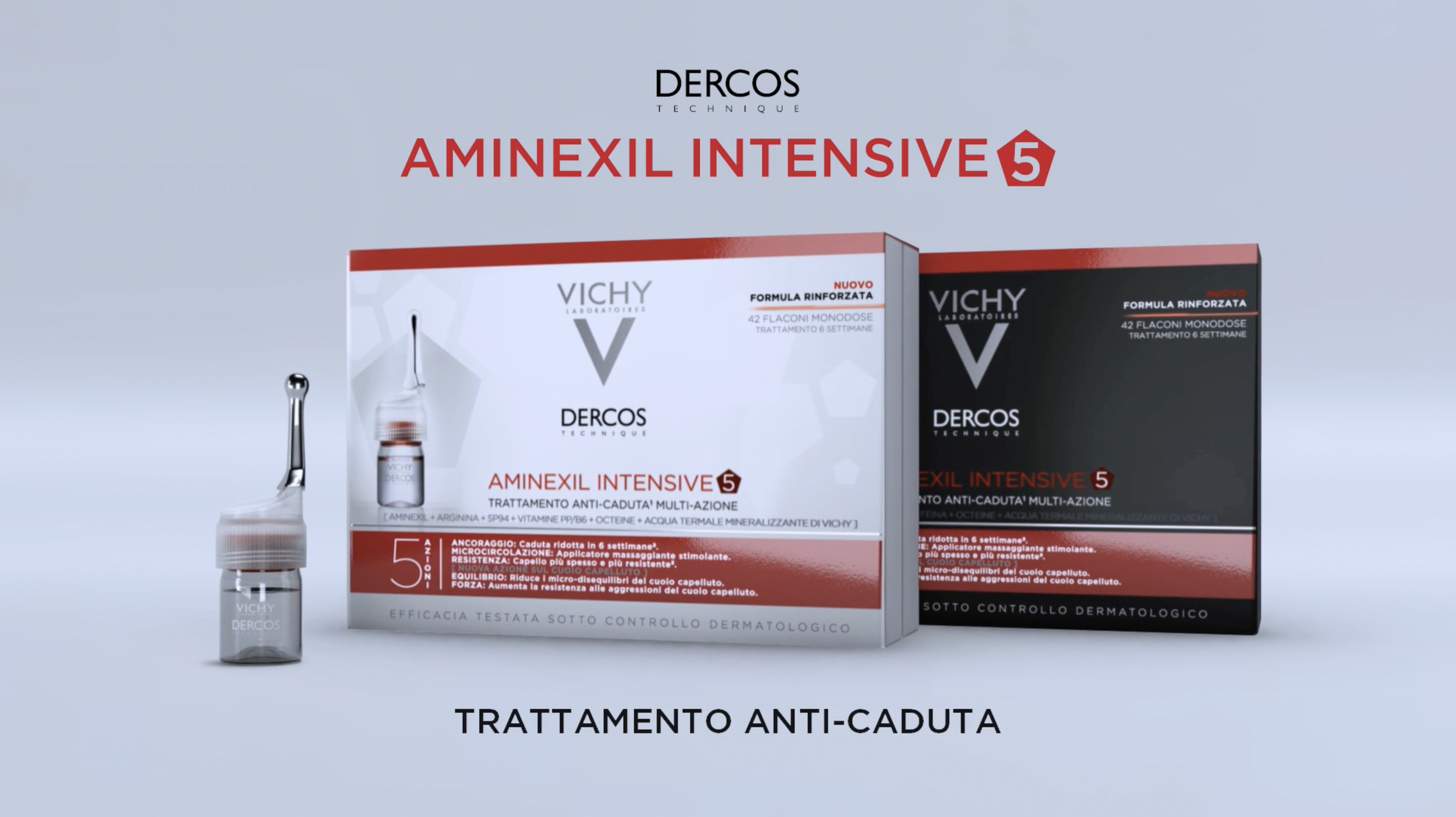 Two boxes of Dercos Aminexil Intensive 5 anti-hair loss treatment and a small glass vial with a brush applicator, both products from Vichy Laboratories.