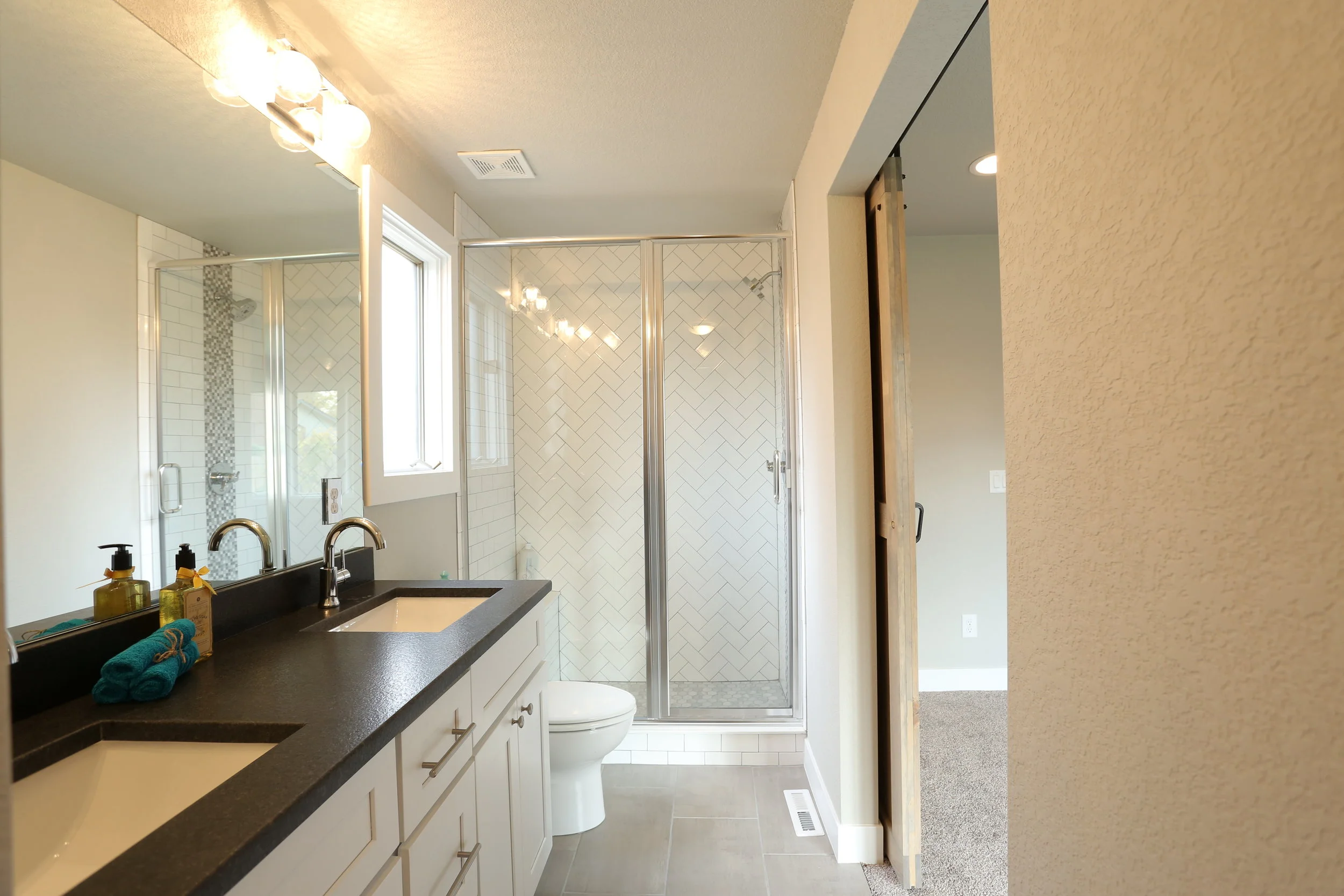 updated master bath with leathered granite counters, new fixtures, new tile