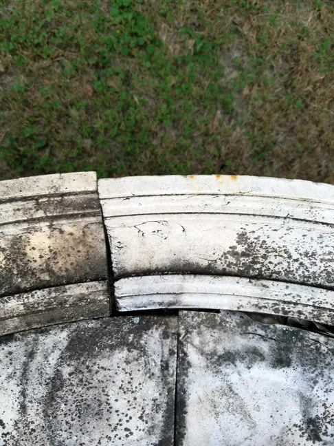 I'm not sure why this table is planted (literally) in the back yard, but the tile that we put on it has become weathered in a very nice way.