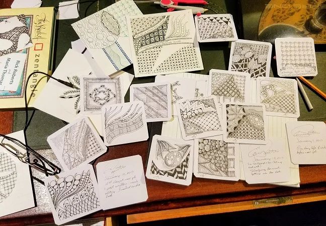 Zentangle desk. I have finished the larger piece that's in the top middle of the picture above – here it is a work in progress.