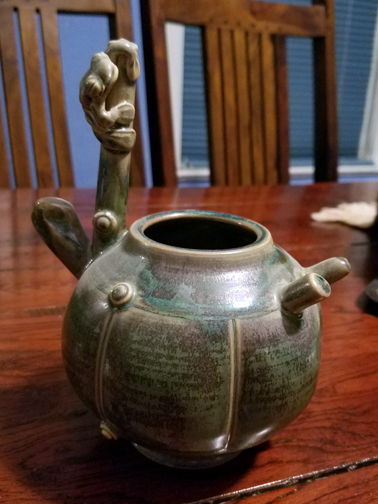 Distinctive glaze and frog are part of Chin's signature style