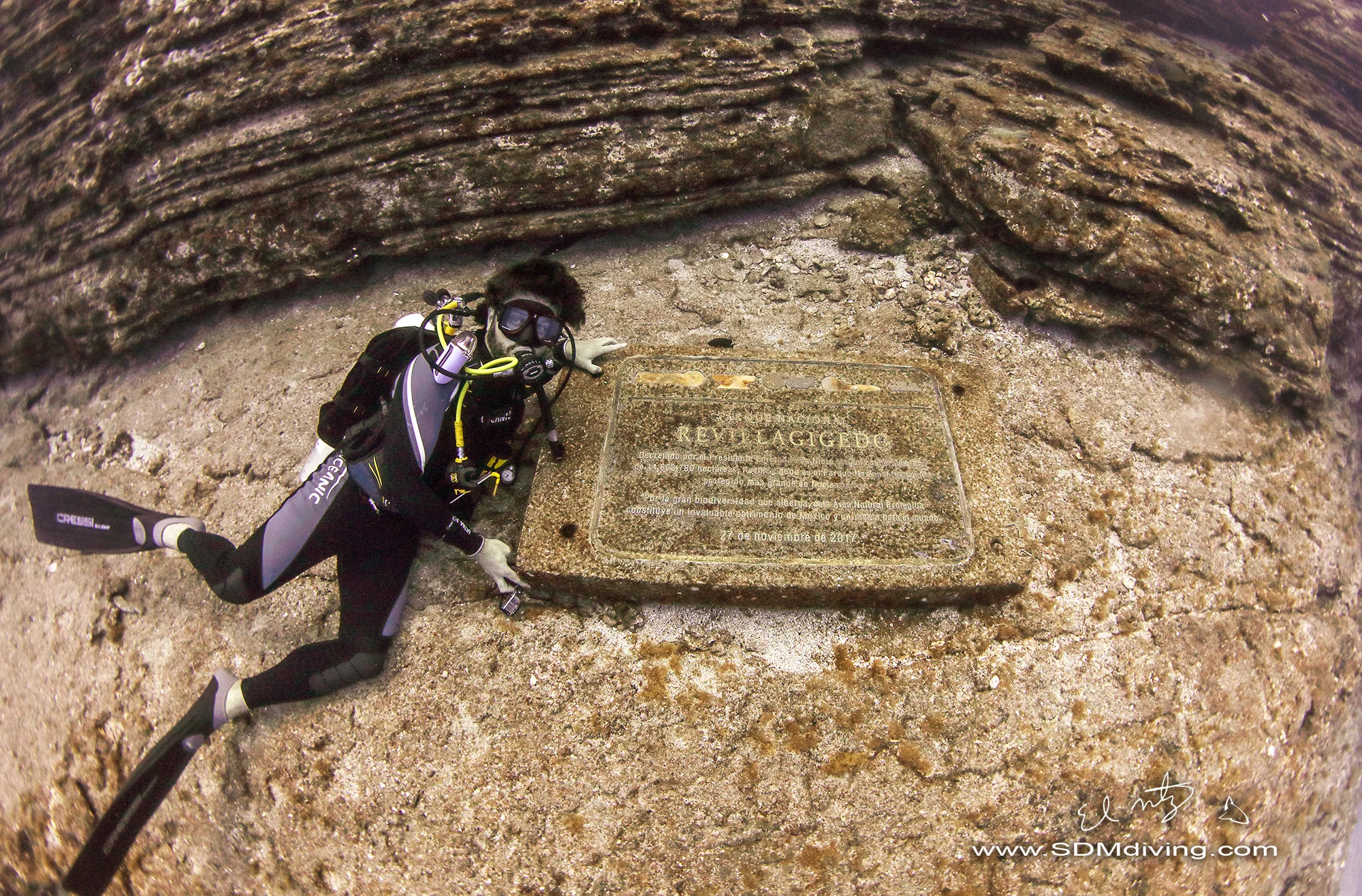 Alex next to a plaque placed at the dive site honoring the UNESCO status. And yup, I took that shot… pretty pumped.
