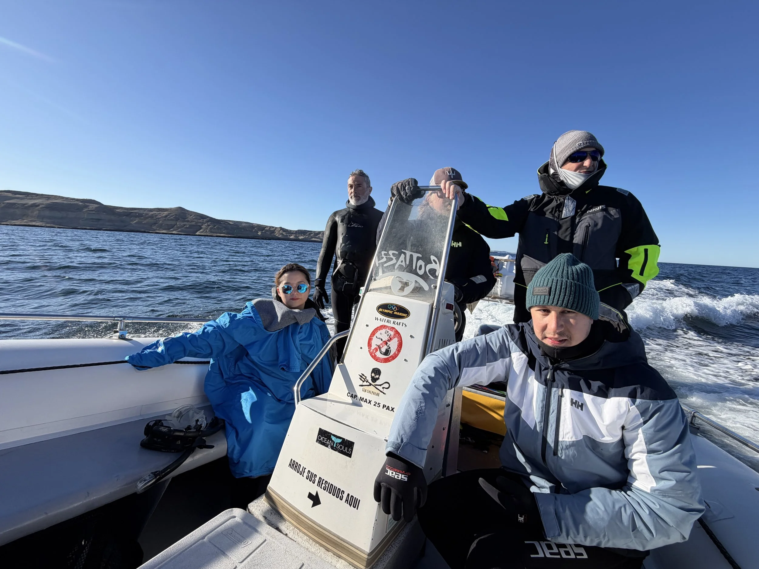 Guests aboard a small boat searching for southern right whales off Puerto Pirámides, Argentina.