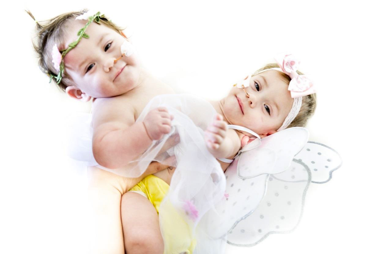The girls at 11 months old, happy and thriving. Thank you for extending your Christian love for those you do not even know, but who through CC@S can feel the comfort of their faith.