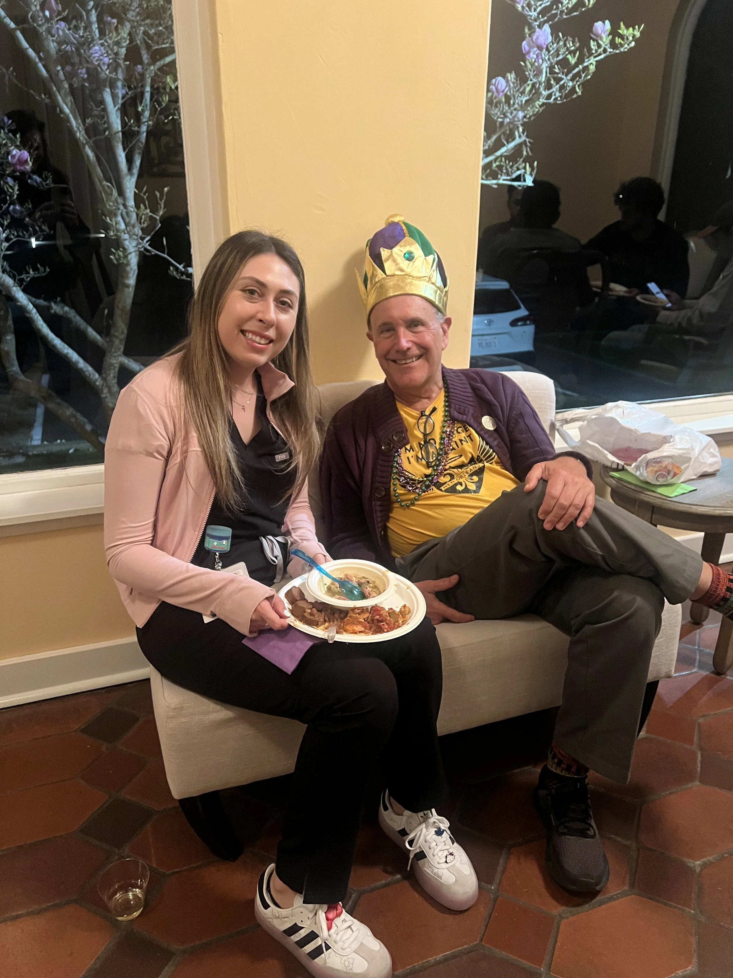 Fr. Bob Glynn, SJ chatting at our annual Mardi Gras party at the Dominican Friars' Arbor House