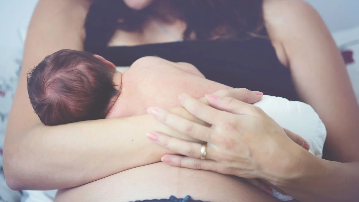 postpartum-mom-breastfeeding-baby.jpg