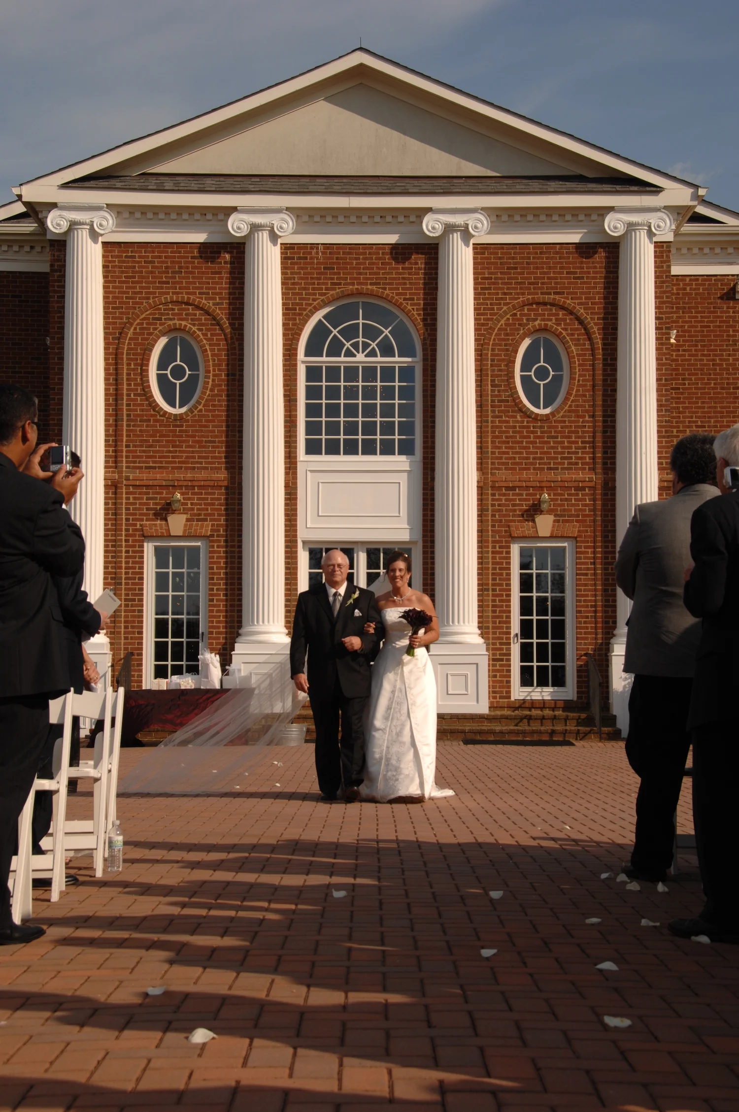 patio-bride-walking-down-patio-with-father.JPG