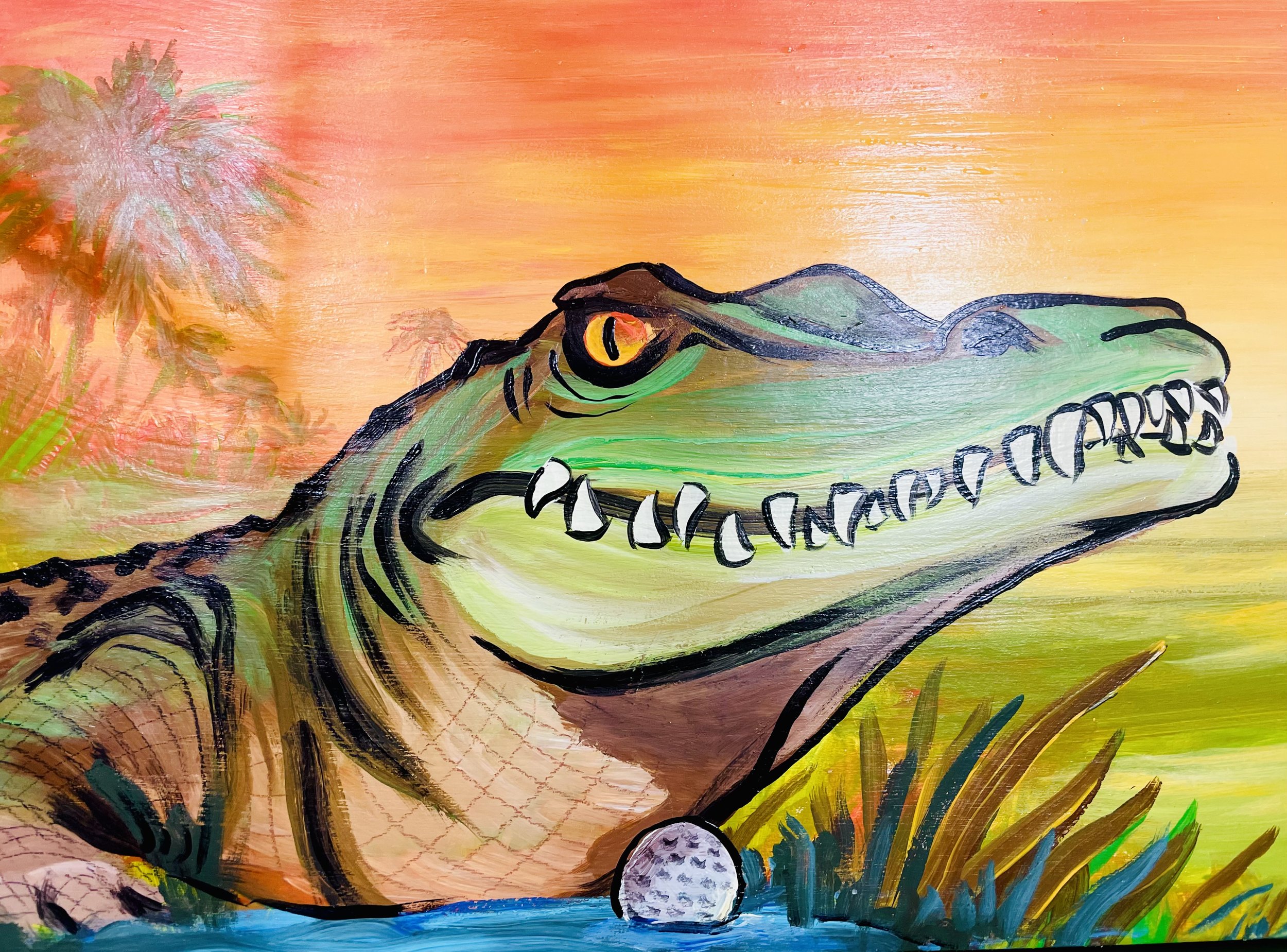 Colorful painting of a crocodile by a body of water, with a golf ball near its mouth, set against a sunset background with palm trees.