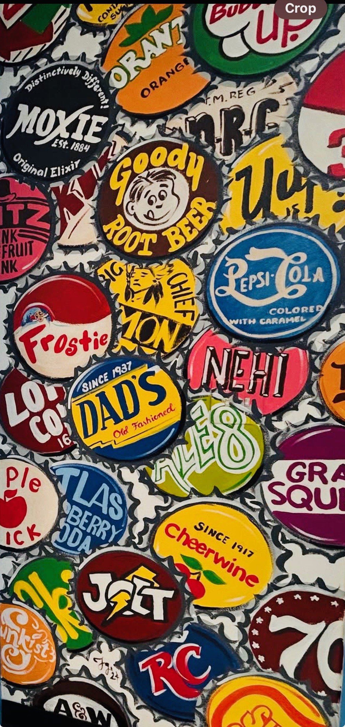 A collage of colorful vintage bottle caps with various logos and slogans, including labels like 'Goody Root Beer,' 'Pepsi-Cola,' 'Dads Old Fashioned,' and 'Cheerwine,' among others.
