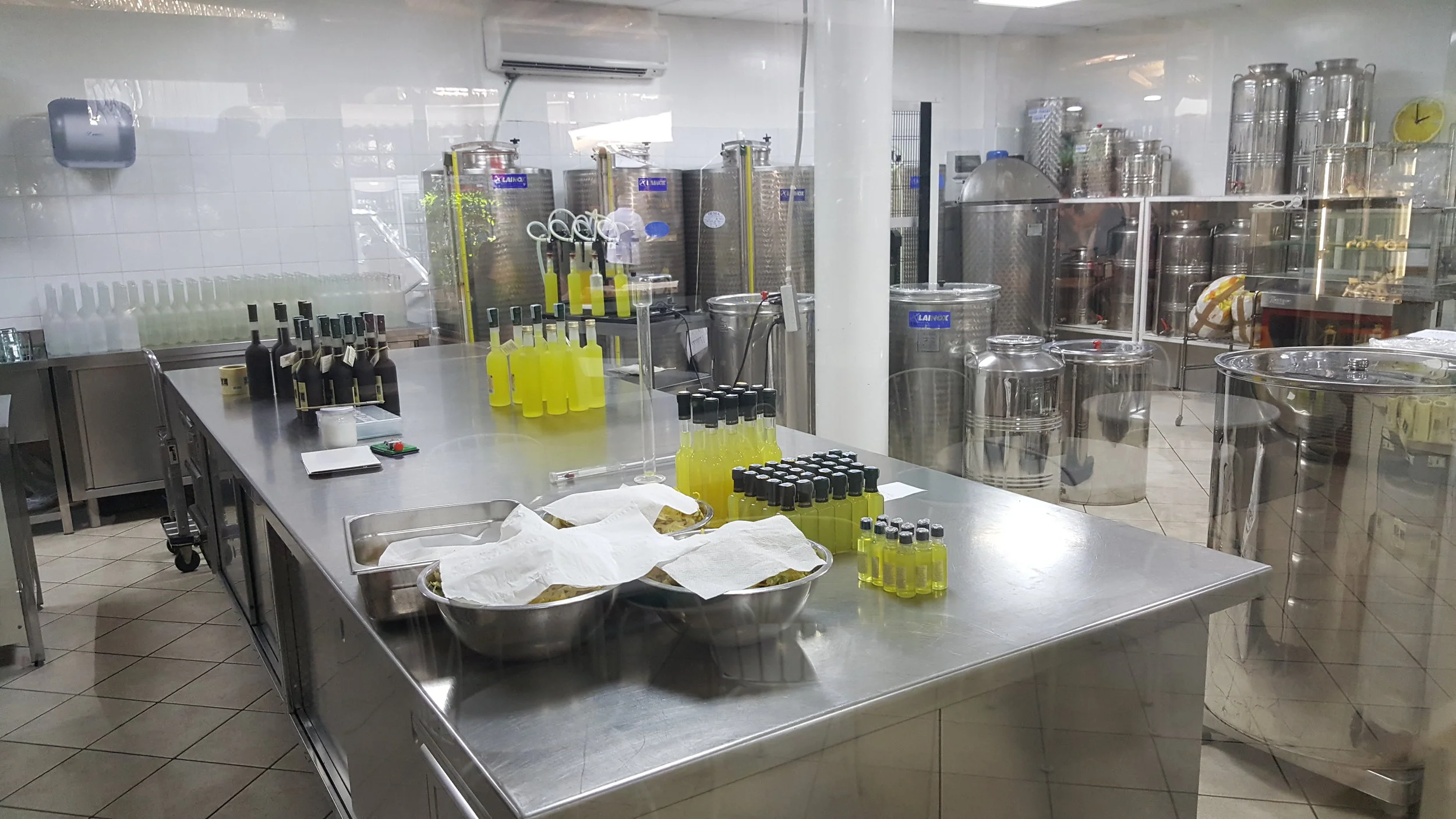  This is in the Giardini di Cataldo (Lemon Grove Garden). You can see the bottles in the back of the picture being filled with lemoncella. 