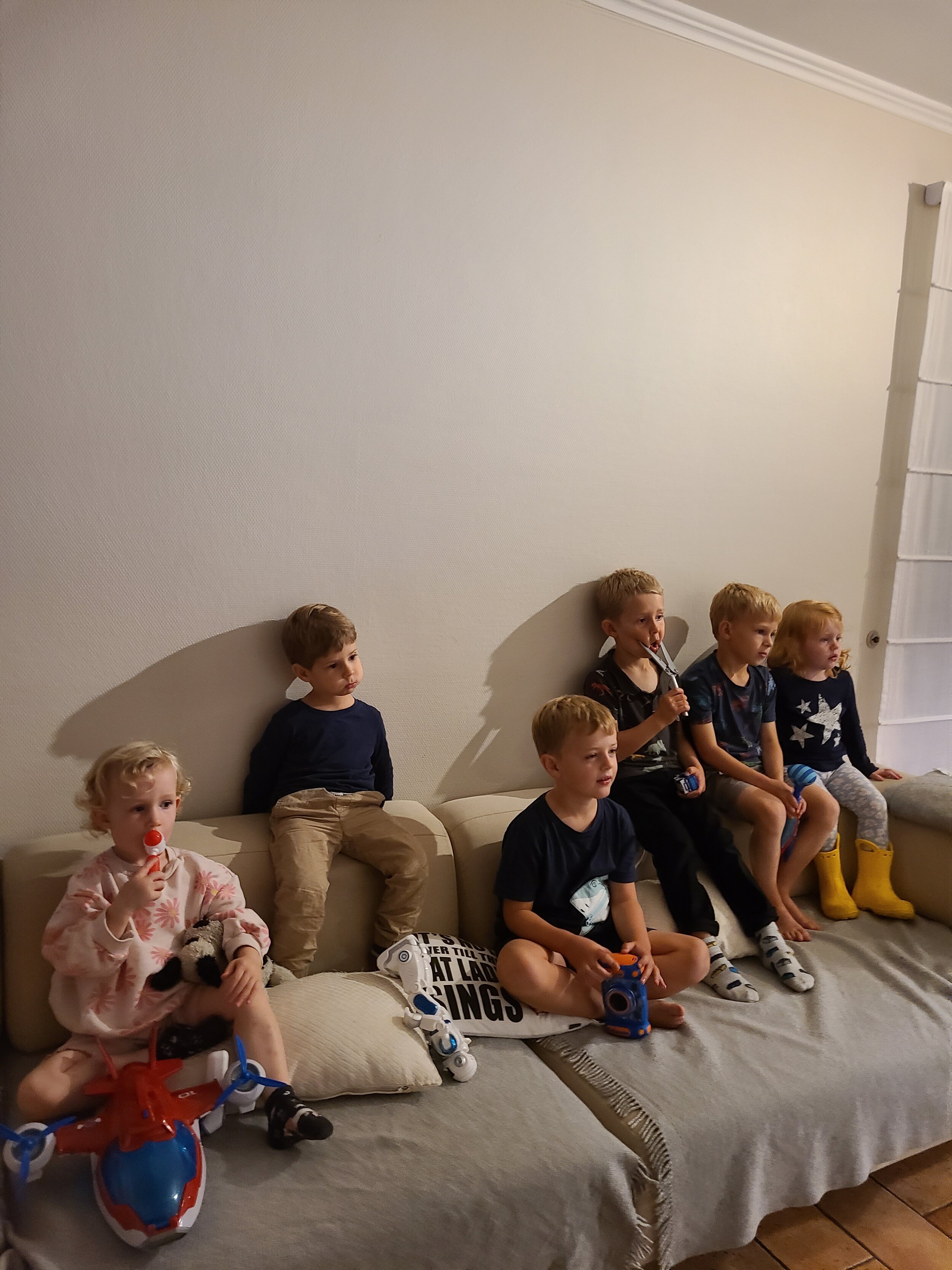  Kids mesmerized after dinner watching television 
